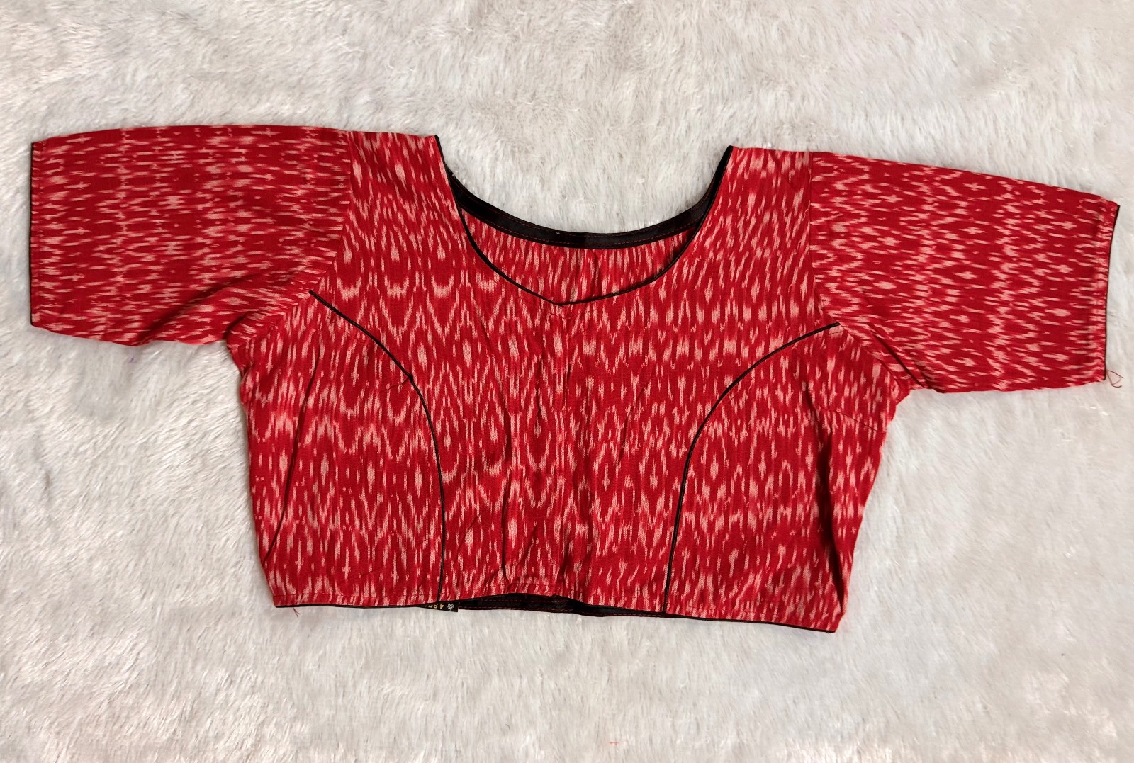 Red ikkat weave pure cotton blouse with black piping