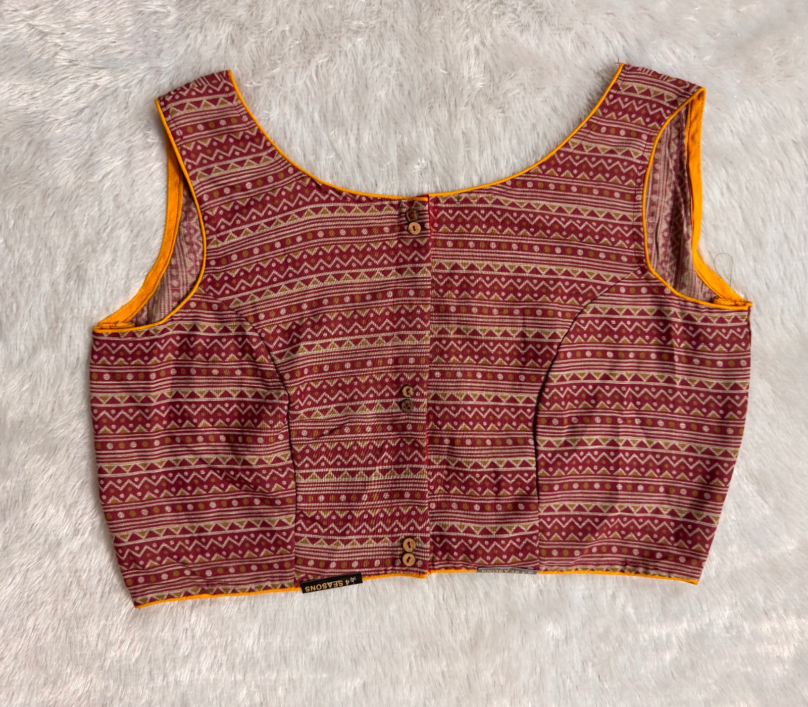 Dusty pink sleeveless blouse with yellow piping