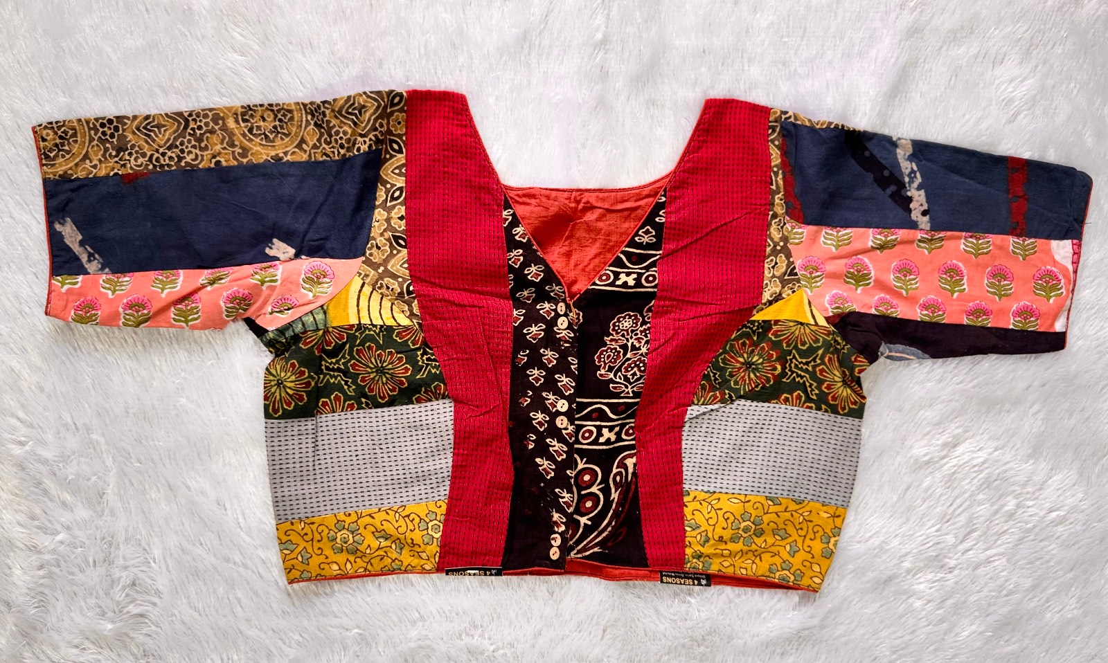 Patchwork v neck blouse with astar & piping