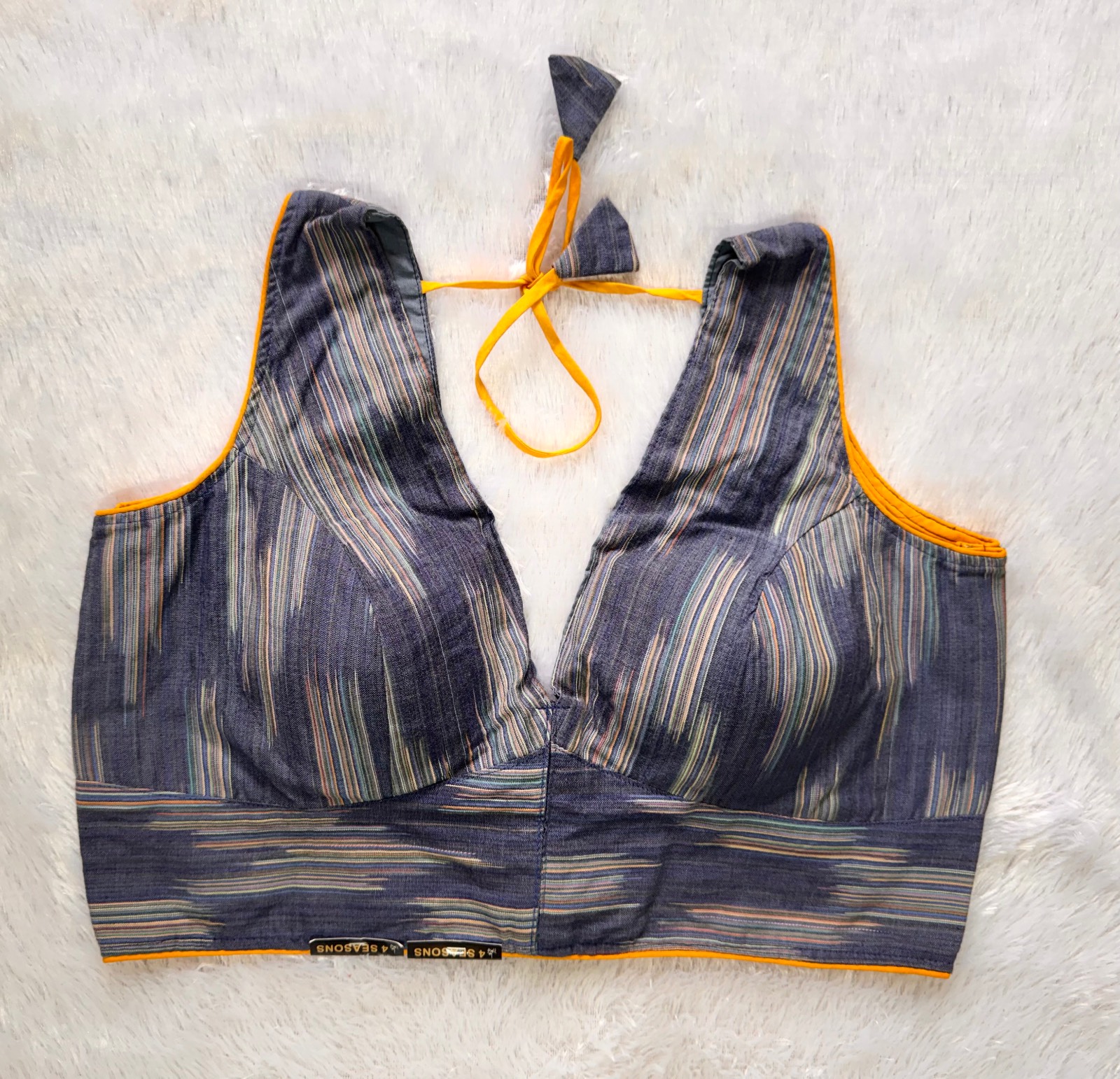 Blue ikkat weave sleevless v neck blouse with back knot